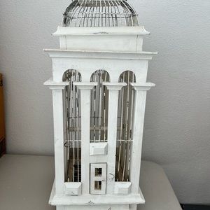 Decorative white wooden bird cage.